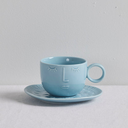 Tasse et soucoupe Visages - Bleu clair